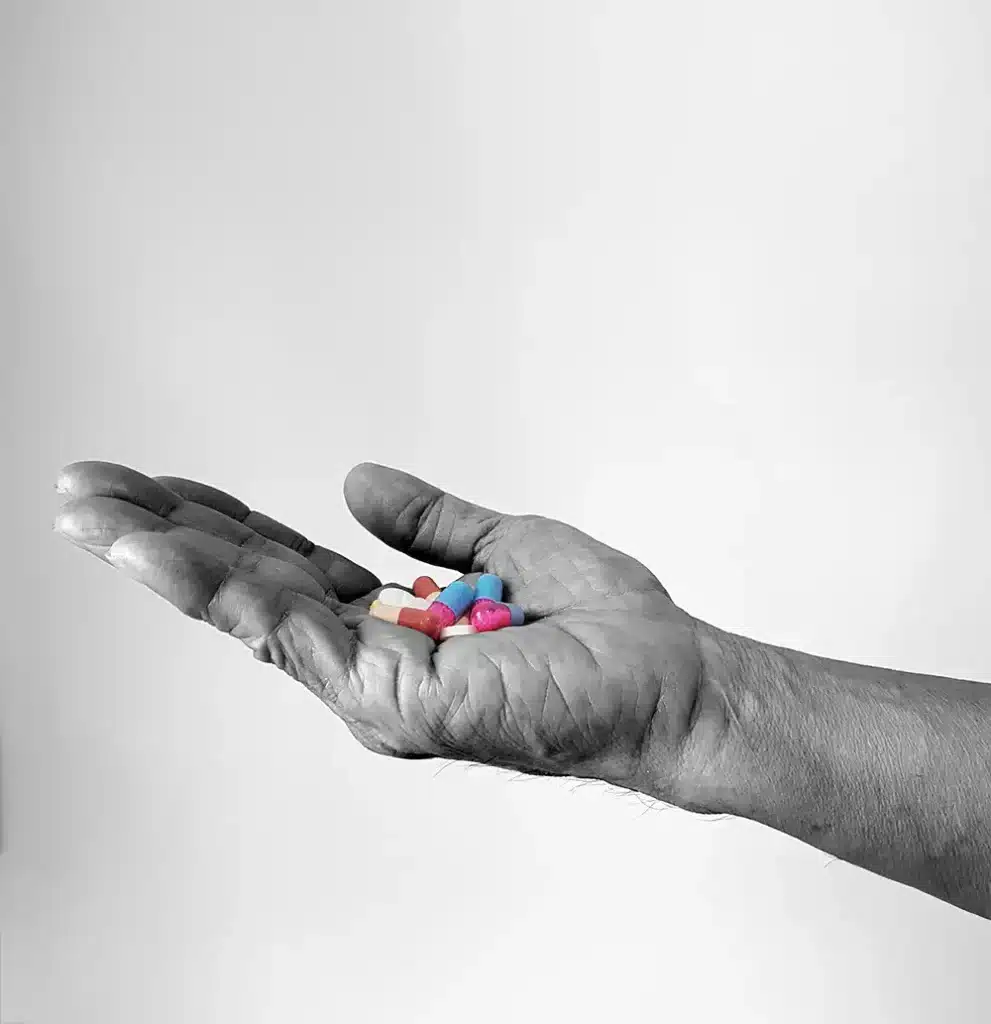 a hand holding medication